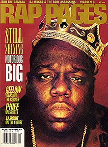 A portrait of the Notorious B.I.G. wearing a bejeweled crown, tilted to his left. He is placed on a red background. Above him is the text "RAP PAGES" in a dark yellow color. On the left side of the cover there are some of the featured stories listed, in a bright yellow font.