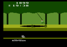 Pitfall Harry swinging over a pit and two rolling logs. The score and timer are at the top. A scorpion is in the cave. A2600 Pitfall.png