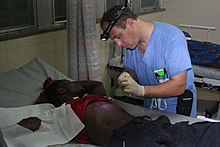 Hospitals of Hope founder Mike Wawrzewski in Liberia. Hospitals of Hope founder Mike Wawrzewski, PAC working at JFK Hospital in Monrovia, Liberia.JPG