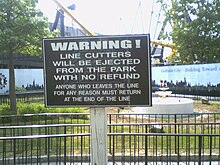 A sign warning people not to cut lines Six Flags Great Adventure warning sign.jpg