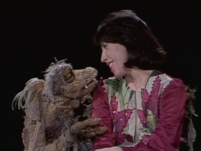 Scred sings "I Got You Babe" with Lily Tomlin on the episode that aired on November 22, 1975.