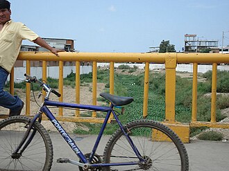 View of Zarumilla River from international bridge linking Ecuador and Peru in Huaquillas Huaquillas-Puente.jpg