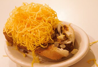 Skyline cheese coney (hot dog topped with Cincinnati-style chili, mustard, onions, and a heap of shredded cheese)