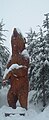 Wooden bear carving in wintertime