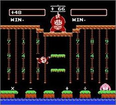 Two players compete by creating arithmetic equations to reach the number held by Donkey Kong (top center). Player 1 (middle left) climbs vines to acquire numbers. Player 2 (bottom right) stands on its starting platform. Donkey Kong Jr. Math.jpg