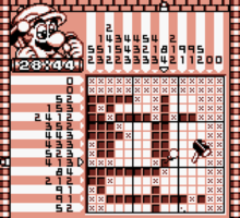 An example of a 15 by 15 Kinoko puzzle. The fifth row down is completed as it has a sequence of two, four, one and two chiseled spaces in it, all with a number of blank spaces in between them, as the numbers beside the row state.