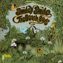 An illustration of an area with excessive greenery occupied by a few smiling animals. In the distance is a small boutique with a smile displayed above its door; chimney smoke spells out the album's title.