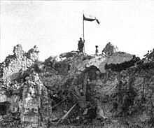 Polish flag flying over the ruins of conquered Monte Cassino monastery, May 1944. Polish Flag Monte Cassino3.jpg