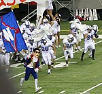 Mr. Raider leads the football team onto the field before a game. RaidersMascot.jpg