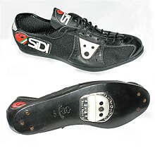 1980s cycling shoe with leather and nylon mesh uppers, leather sole, and adjustable shoeplate, for use with "quill" pedals Sidi Super Cycle shoe 43.5.jpg