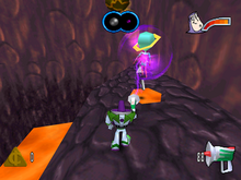 Buzz Lightyear fighting the second villain of the game, Gravitina, who has a colored shield which indicates which weapon will be effective against them (Windows version). BuzzLightyearofStarCommandLevel2screenshot.png