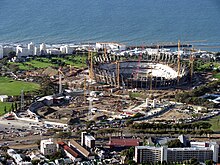 Partial demolition of the Green Point Stadium (foreground) during construction of the adjacent new Cape Town Stadium (background)