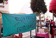 QUIT activists outside Macy's San Francisco store on Valentine's Day, 2004. Banner says, "Killer Products from Estee Slaughter", referring to Estee Lauder Companies. ES val banner.jpg