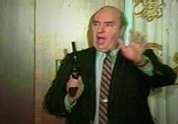 A video still showing Dwyer holding a .357 Magnum revolver, seconds before committing suicide by shooting himself through the roof of his mouth.