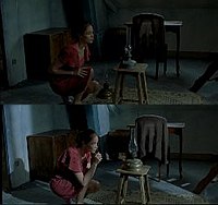 The use of lighting is important in the cinematography. The top panel shows the light dimming as one oil lamp is placed on a chair in the attic room, and the bottom panel shows the light brightening as Marie correctly replaces that lamp with a second lamp.