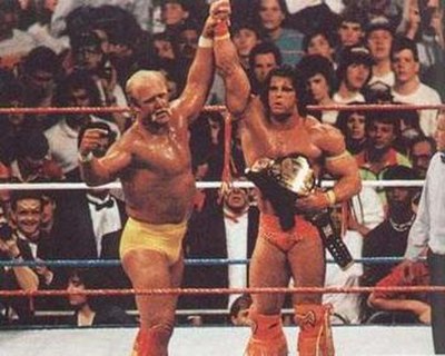 Hulk Hogan (left) endorsing The Ultimate Warrior after Warrior defeated him to win the WWF Championship at WrestleMania VI