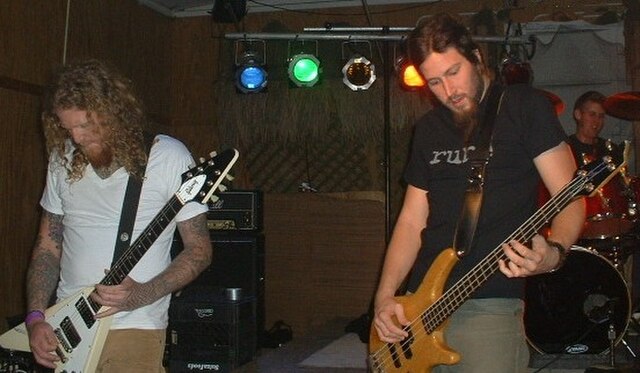 Brent Hinds, Troy Sanders and Brann Dailor in 2004