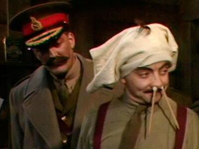 General Melchett catches Blackadder pretending to be mad. Melchett represents the "lions led by donkeys" perception of the war, and is an amalgam of D