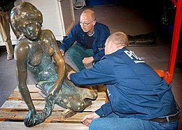 Police technicians examine the damage to The Little Mermaid after it was blasted off its base on 10 September 2003. Little mermaid examined.jpg