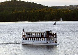 The MV Kearsarge on Lake Sunapee with Herrick Cove Lighthouse at a distance Sunapee dinner boat.jpg