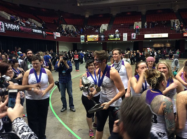 2015 MVP Scald Eagle of the Rose City Rollers with the Hydra Trophy after the 2015 WFTDA Championships