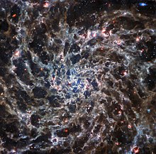 IC 5332, taken by the NASA/ESA/CSA JWST observatory with its MIRI instrument Webb s view on spiral galaxy IC 5332 smaller-Custom.jpg