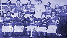 The original first team poses with the Austin Cup in 1963 DynamosOriginals1963.jpg