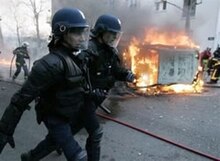 A torched car burns in Paris on 18 March Frenchriot-18-mar-06.jpg