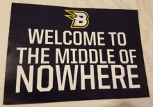 Middle of nowhere placard given out pre-game on 28 May 2016 for the CBR Brave vs Newcastle North Stars AIHL match CBR Brave Welcome to the Middle of Nowhere Placard, May 2016.png