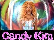 An image of a dark-skinned woman wearing a blonde/orange wig with the words 