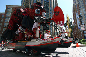 The 2011 Grand Mediocre East Coast Champion was Platypus. Built by David Hess, the two-ton sculpture is powered on land and water by 8 pilots, with an additional driver steering it along the 15-mile racecourse. Here, it races through Baltimore's Fell's Point neighborhood. PlatypusKineticSculptureChampion2010.jpg