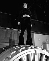 Chaidez (pictured) is known for climbing atop high surfaces during performances Chloe Chaidez performing at The Federal Underground.jpg