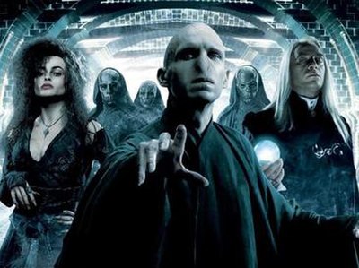 Voldemort (centre) with Bellatrix Lestrange (left), Lucius Malfoy (right) and several masked Death Eaters (back) in Harry Potter and the Order of the 