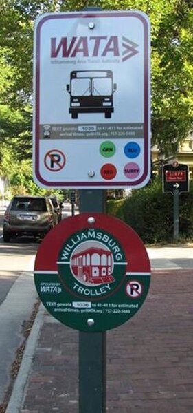 A WATA Bus and Trolley sign, with information to locate the next bus.