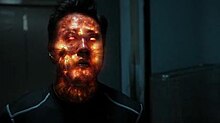 The fiery extremus virus inside the character Chan Ho Yin begins——to explode, his face glowing orange