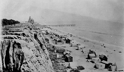 Looking south across the bluffs, the Arcadia Hotel sits at the end of the pier, 1888.