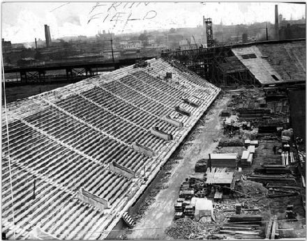 Workmen laying bricks on south wall of Franklin Field, circa 1922
