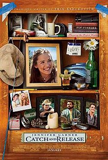 A shelf full of photos, books, and fishing related knick-knacks.