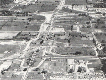 An aerial view, facing north, of the reconstruction of Highway 27 to a four-lane freeway during the early 1950s