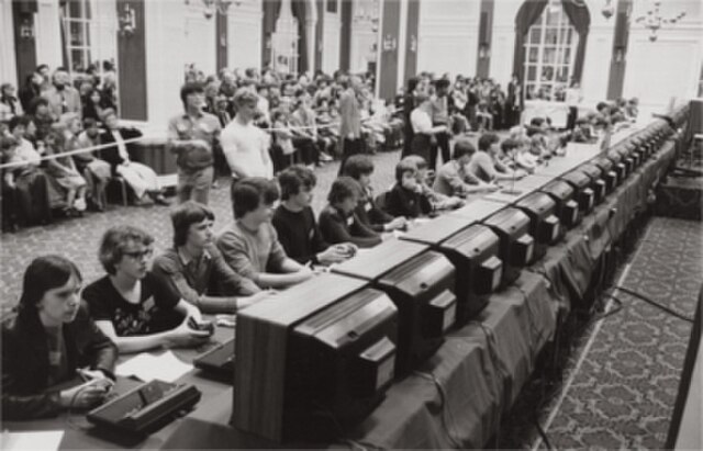 Attendees of the 1981 Space Invaders Championships attempt to set the highest score.