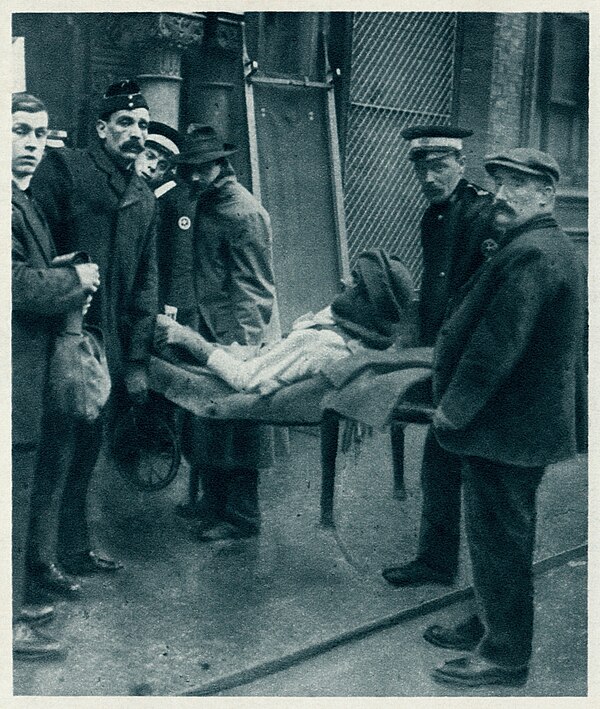 Image from The Illustrated War News of 23 December 1914 showing the injured Khan being carried into the Royal Pavilion, Brighton then in use as a hosp