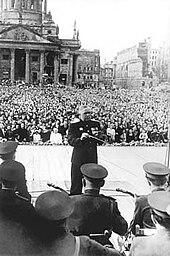 1948 peace concert at Berlin. Photo taken by member of choir from stage, probably using Boris Alexandrov's camera. Boris Alexandrov has posed for this, holding baton still.