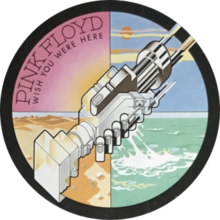The circle sticker at the right-centre position shows two machines clasped together, resembling a handshake. The whole circle is divided into four quarters in different colours. The pink quarter, located on upper-left, has the sun shining and "PINK FLOYD" in big font; below the band name is "WISH YOU WERE HERE" in small font. The yellow quarter at lower-left displays sand dunes. The blue quarter at upper-right shows blue skies. The green quarter at lower-right displays green- or teal-coloured water.