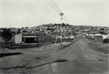 View towards the first established residences along the Westdene streets (Source: Museum Africa) First stands in Westdene, Johannesburg in the 1920's.png