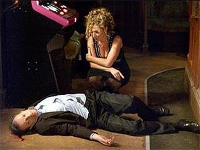 Chrissie kneeling over Den's corpse during the 20th anniversary episode. Consolidated figures reveal the episode was seen by over 17 million viewers (