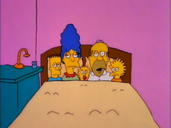 An early image of entire Simpson family (Bart, Marge, Maggie, Homer, Lisa) in the same bed