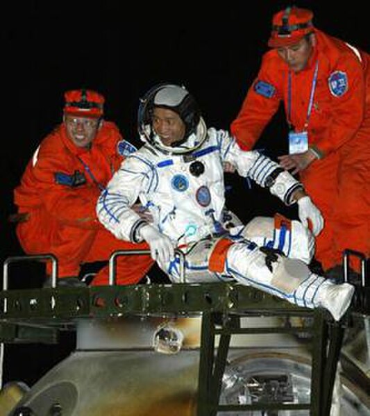 Nie Haisheng exits the re-entry capsule of Shenzhou 6 at the main landing field in Central Inner Mongolia Autonomous Region.