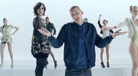 Allen and Green on the conveyor belt, in the music video for "Just Be Good to Green". Allen and Green Music Vid.png