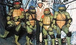 Jim Henson on set with the suit actors. The film was released less than two months before Henson's death. Jim Henson and Ninja Turtles 1990.jpeg