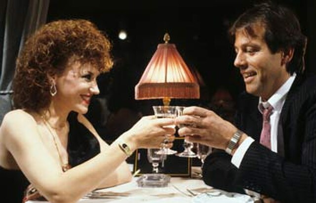 Angie and Den have dinner together on the Orient Express (1986).